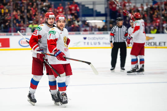 Alexander Romanov and Alexander Khovanov of Russia react