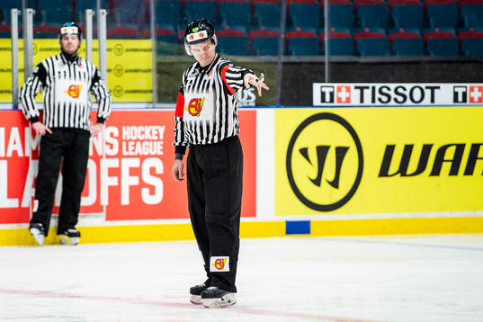The referee signals for goal