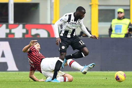 Zlatan Ibrahimovic of AC Milan and Ken Sena of Udinese