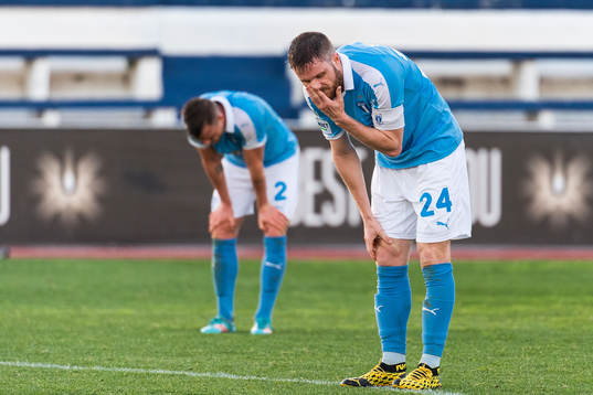 Eric Larsson and Lasse Nielsen of Malmö FF look dejected