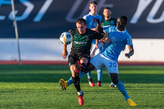 Illya Martynov of Krasnodar and Bonke Innocent of Malmö FF