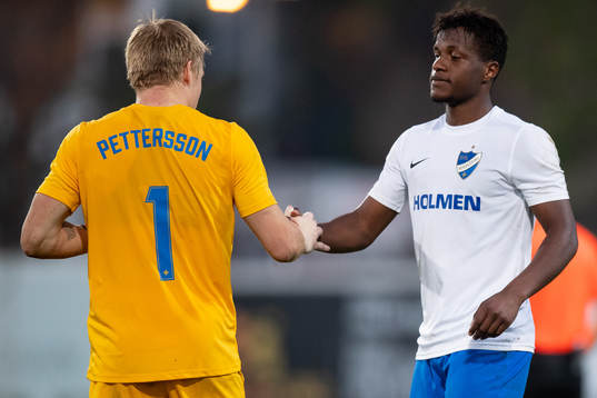 Goalkeeper Isak Pettersson of Norrköping and Manasse Kusu