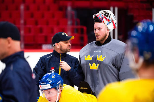 Goalie coach Stefan Ladhe and goalkeeper Magnus Hellberg