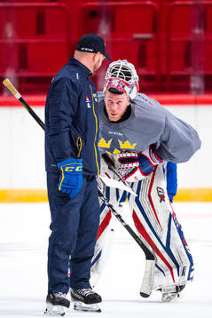 Goalie coach Stefan Ladhe and goalkeeper Magnus Hellberg