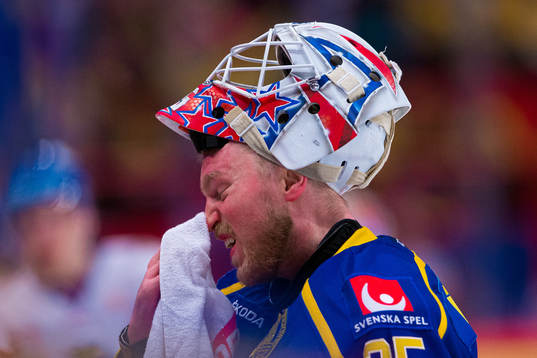 goaltender Magnus Hellberg of Sweden looks dejected