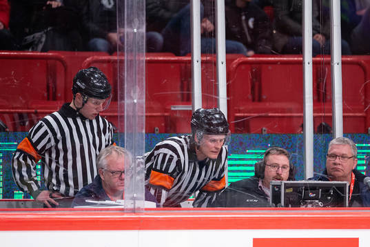 Referees Joonas Kova and Aaro Brännare conducting a video