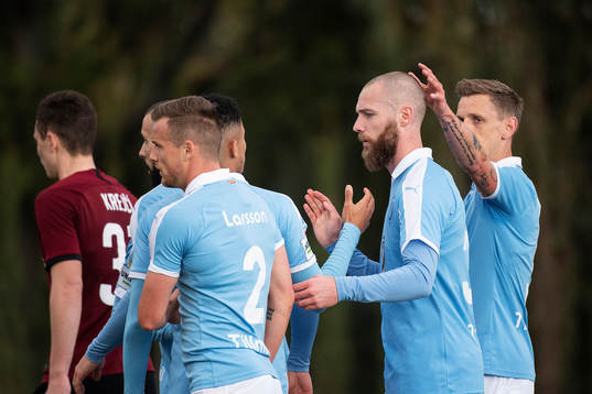 Sören Rieks and Jo Inge Berget of Malmö FF celebrate