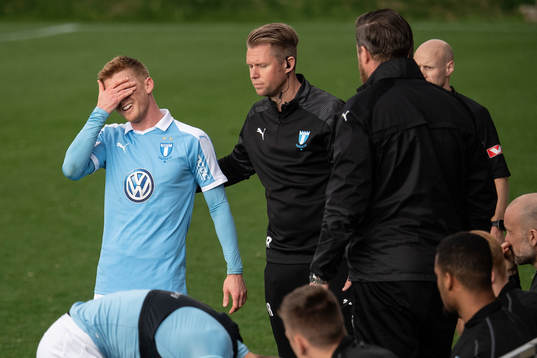 Anders Christiansen of Malmö FF leaves the pitch in pain
