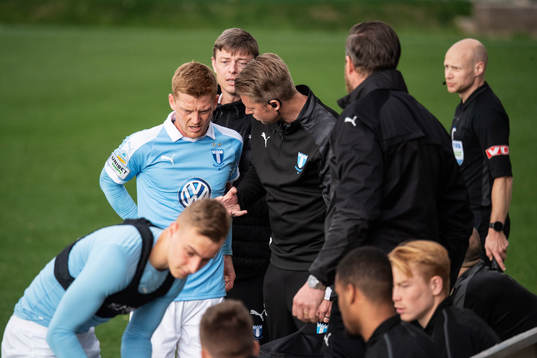 Anders Christiansen of Malmö FF leaves the pitch in pain