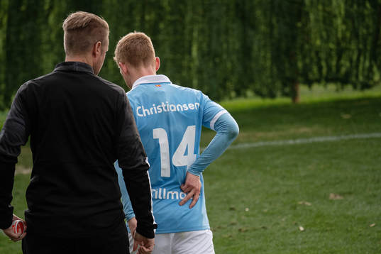 Anders Christiansen of Malmö FF leaves the pitch in pain