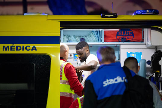 Maic Sema of Norrköping leaves the arena in an ambulance