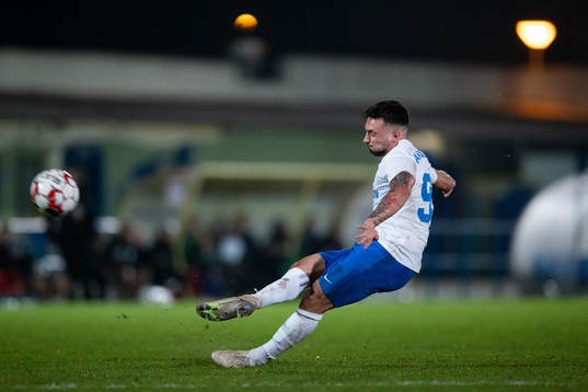 Sead Haksabanovic of Norrköping slips when shooting a free