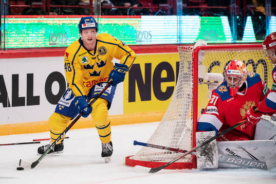 Carl Klingberg of Sweden and goalkeeper Alexander Samonov