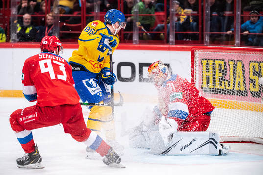 Mathias Bromé of Sweden and goalkeeper Alexander Samonov