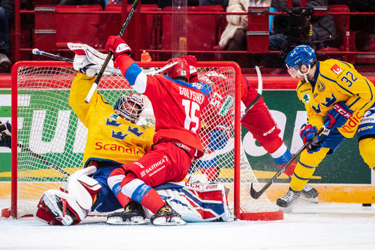 Goaltender Lars Johansson of Sweden and Anatoly Golyshev of
