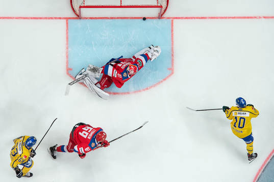 Marcus Nilsson of Sweden scores 1-0 behind goalkeeper