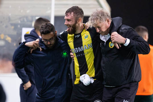Simon Sandberg of Hammarby leaves the pitch due to injury