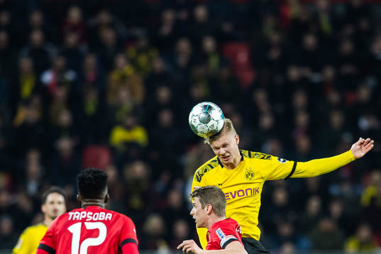 Erling Braut Haaland of Borussia Dortmund and Sven Bender