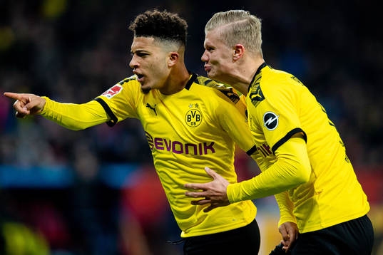 Jadon Sancho of Borussia Dortmund celebrates with teammate