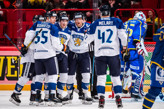 Joel Mustonen of Finland celebrate with teammates