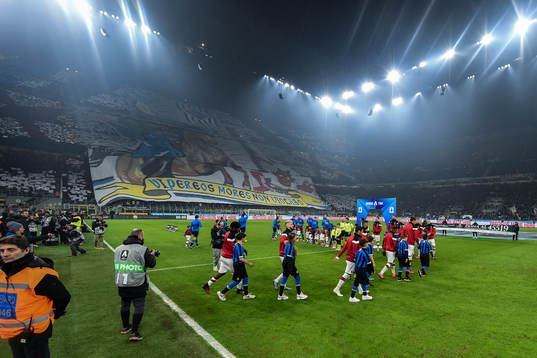 Players of Inter and Milan enters the field