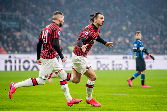 Zlatan Ibrahimovic and Ante Rebic of Milan celebrate