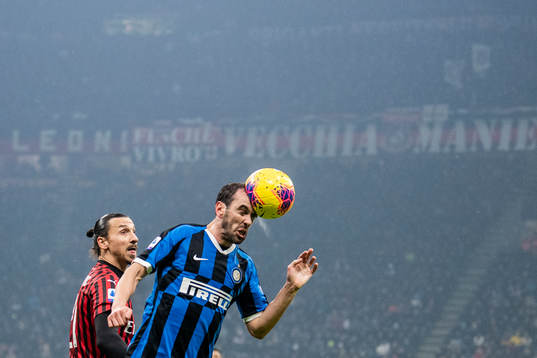 Diego Godin of Inter and Zlatan Ibrahimovic of Milan