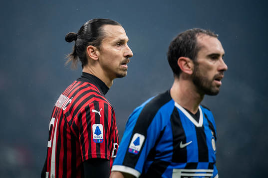 Zlatan Ibrahimovic of Milan and Diego Godin of Inter