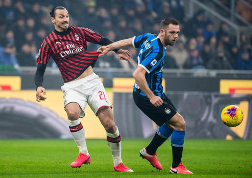 Zlatan Ibrahimovic of Milan and Stefan de Vrij of Inter