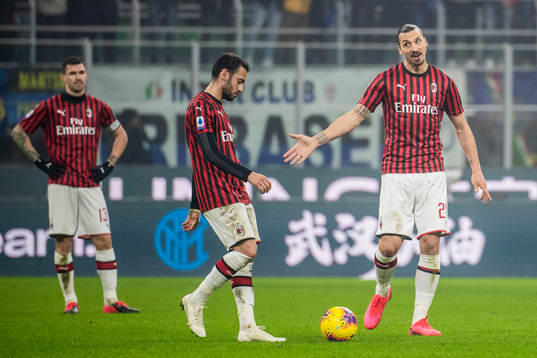 Hakan Calhanoglu and Zlatan Ibrahimovic of Milan