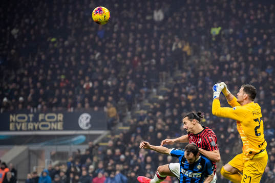 Zlatan Ibrahimovic of Milan against goalkeeper Daniele