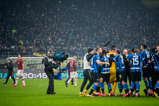 Zlatan Ibrahimovic of Milan looks dejected as players of