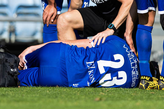 Emil Holm of IFK Göteborg is seen to by medical staff due