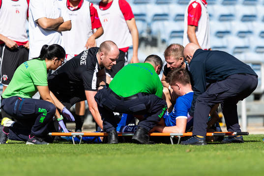 Emil Holm of IFK Göteborg is seen to by medical staff due