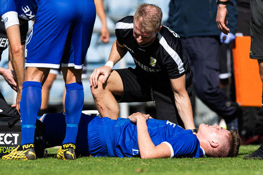Emil Holm of IFK Göteborg is seen to by medical staff due