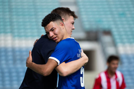 Emil Holm of IFK Göteborg gets a hug from team mate