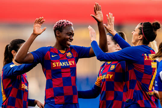 Asisat Oshoala of Barcelona celebrates with teammates