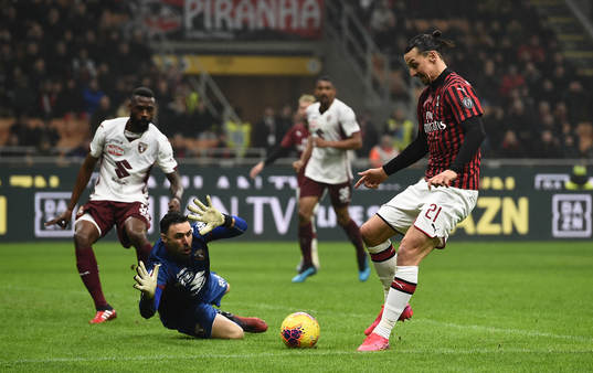Zlatan Ibrahimovic of Milan against goalkeeper Salvatore
