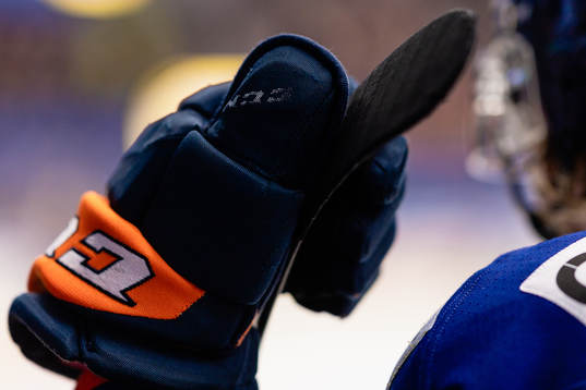 Hockeyhandske och klubba