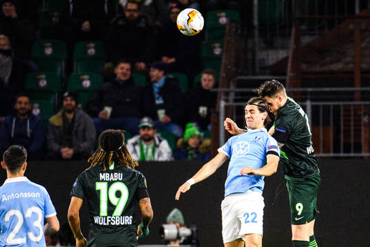 Adi Nalic of Malmö FF and Wout Weghorst of Wolfsburg