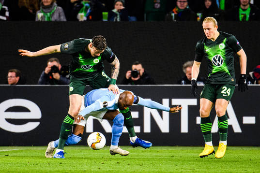 Fouad Bachirou of Malmö FF and Wout Weghorst of Wolfsburg