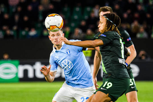 Marcus Antonsson of Malmö FF and Kevin Mbabu of Wolfsburg