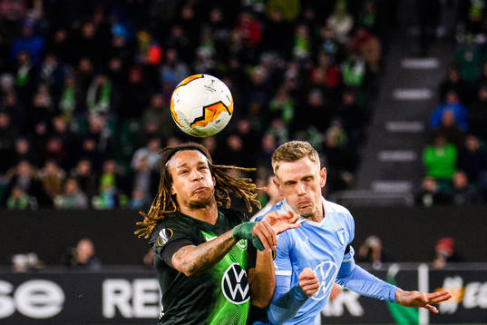 Sören Rieks of Malmö FF and Kevin Mbabu of Wolfsburg