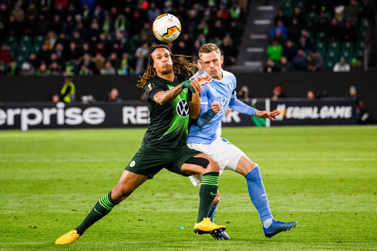 Sören Rieks of Malmö FF and Kevin Mbabu of Wolfsburg