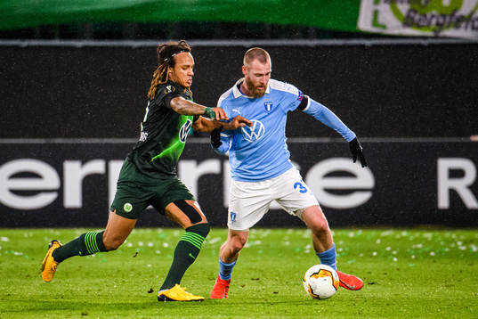 Kevin Mbabu of Wolfsburg and Jo Inge Berget of Malmö FF