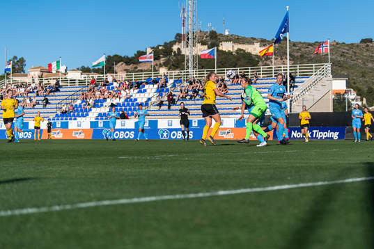Emilie Nautnes of LSK Kvinner compete for the ball with