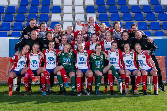 Lyn poses for a team photo