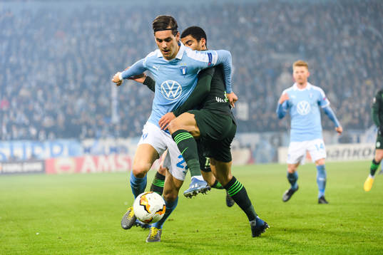 Adi Nalic of Malmö FF and Paulo Otavio of Wolfsburg