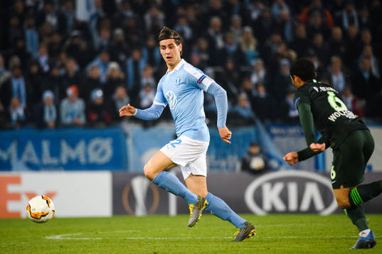 Adi Nalic of Malmö FF and Paulo Otavio of Wolfsburg