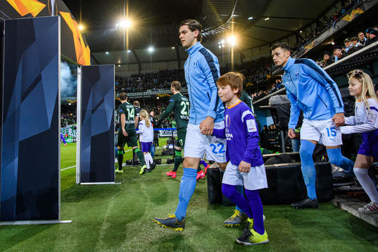 Adi Nalic and Anel Ahmedhodzic of Malmö FF enters the pitch